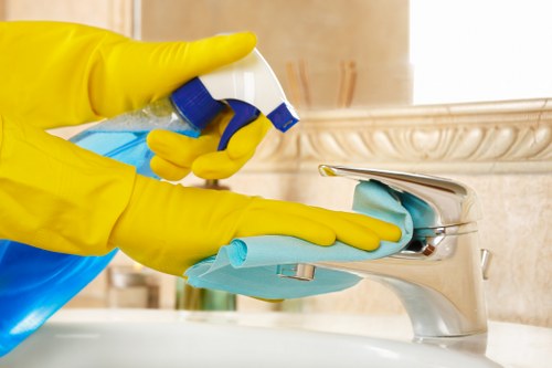 Cleaning technician preparing carpet cleaning equipment safely